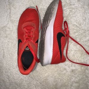 Red Nike running shoes